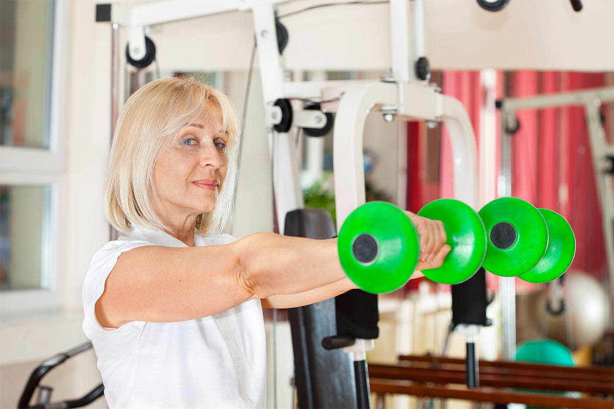 Confident woman doing weight exercises.