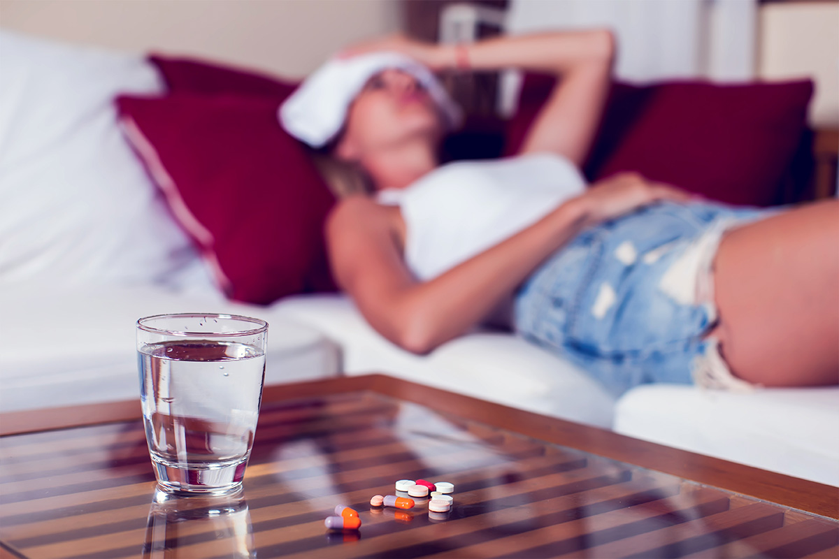 Woman in quiet discomfort from tension headache, reflecting symptoms treatable through physical therapy.